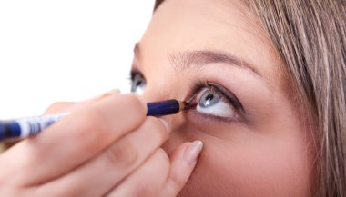 Applying make-up on eyes clipart