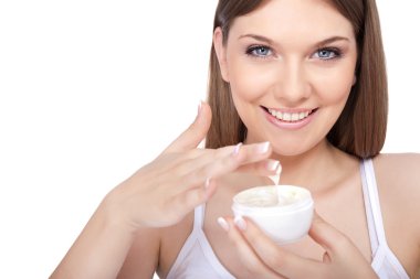 Young woman applying body lotion clipart