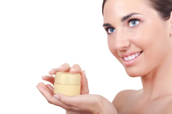 Vrouwen met perfecte huid crème houden — Stockfoto