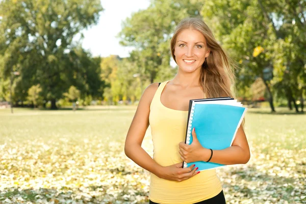 Student girl with book outdoor — Stock Photo, Image
