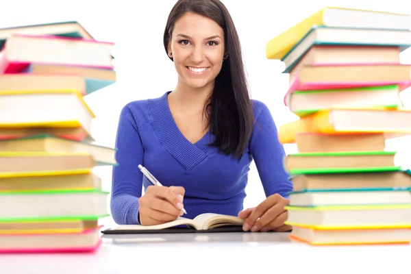 Lächelnder Student mit vielen Büchern — Stockfoto