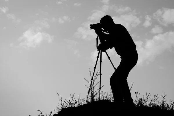 Silhouette of the photographer — Stock Photo, Image