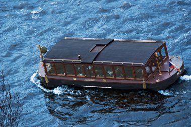 Touristic ship on the river Vltava in Prague clipart