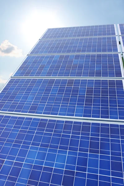 Solar panels sun and sky vertical — Stock Photo, Image