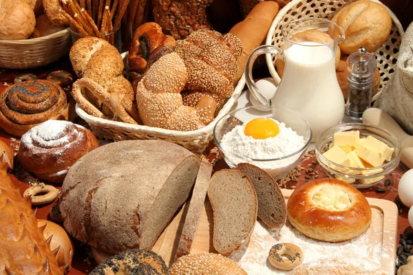Bread, flour, milk, butter, eggs — Stock Photo, Image
