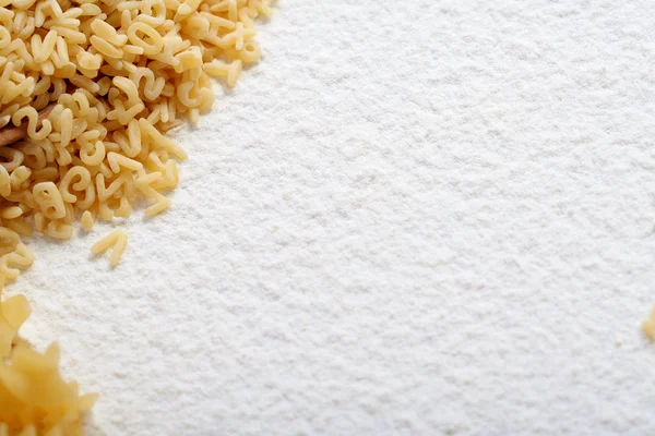 Eatable alphabet on flour — Stock Photo, Image