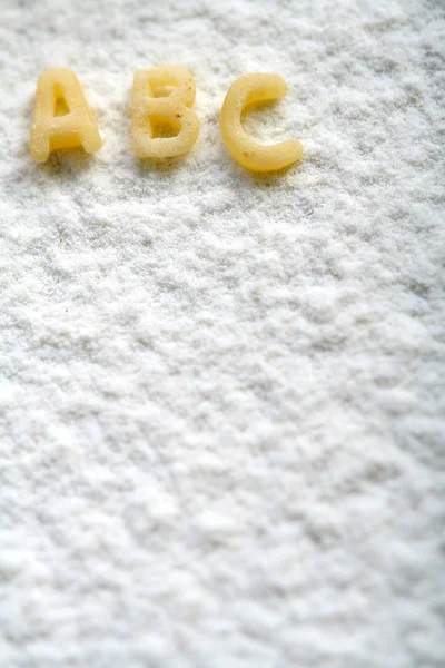 Eatable alphabet on flour, education — Stock Photo, Image