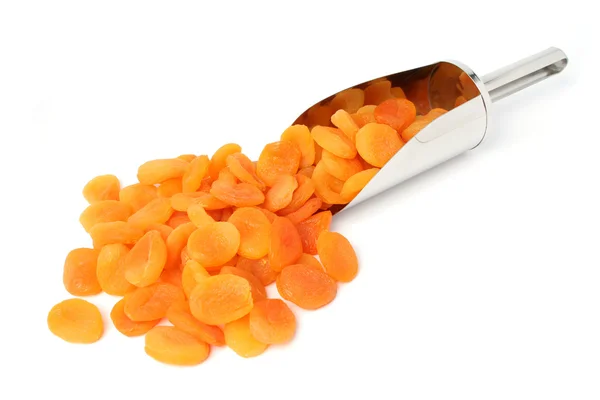 Dried apricots and metal scoop — Stock Photo, Image