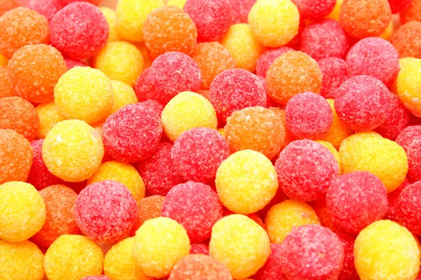 Doces de açúcar redondos de cor vermelha e amarela — Fotografia de Stock