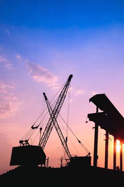 Cranes working at sunset — Stock Photo, Image