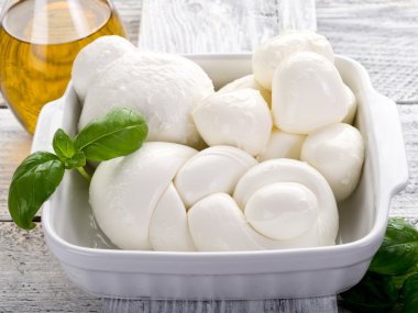 Vatiety of italian buffalo mozzarella-mix mozzarelle di bufala clipart