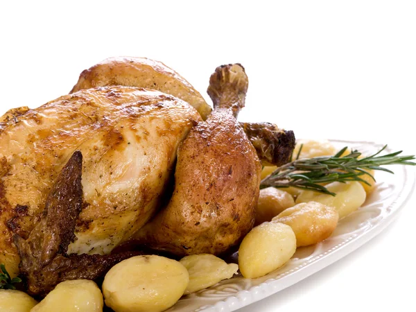 Kyckling med potatis-pollo arrosto e patate — Stockfoto