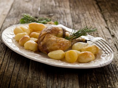 Chicken leg with potatoes-coscia di pollo e patate clipart