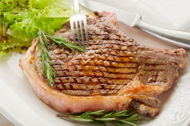 Grilled t bone on dish clipart