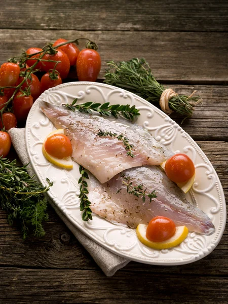 Fish fillet with herbs ready to cooking — Stock Photo, Image