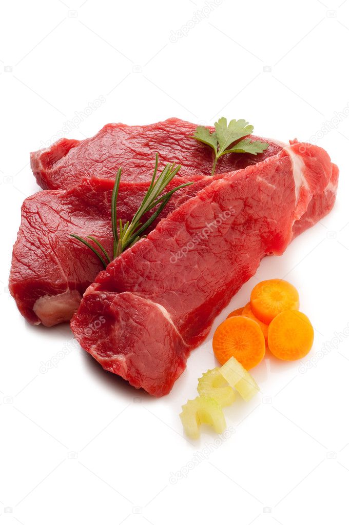 Raw steak with ingredients