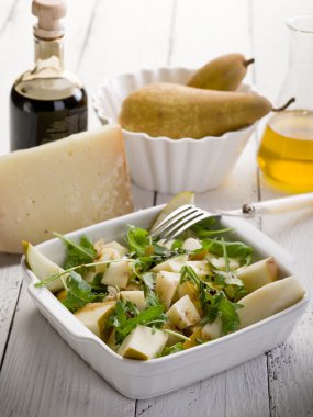 Cheese and pears salad with baslamic vinegar and olive oil clipart