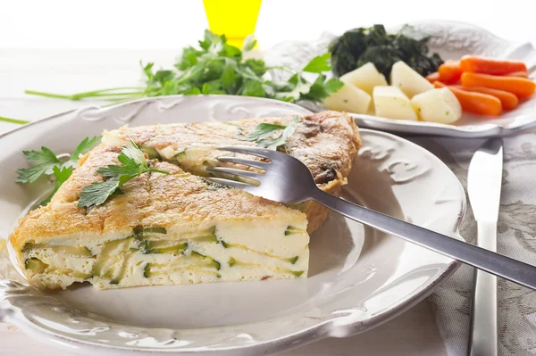 Omelette with zucchinis and parsley — Stock Photo, Image