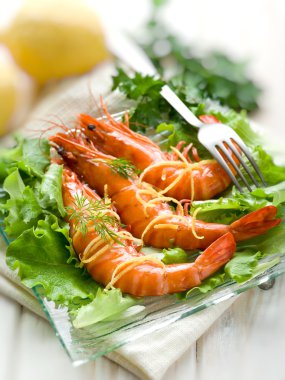 Giant shrimp with green salad clipart