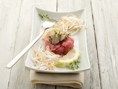Tuna tartar with truffle and soy sprouts clipart