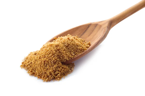 Brown sugar over wood spoon — Stock Photo, Image