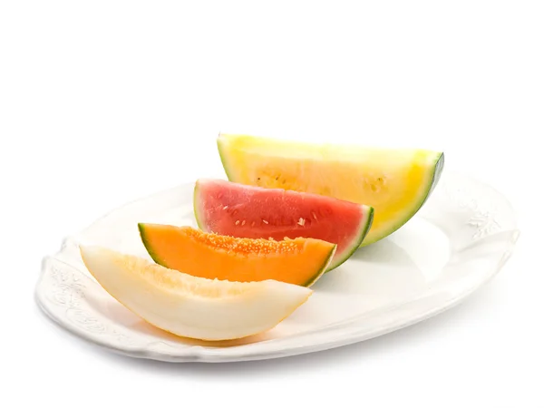 Variedad de rebanada de melón en el plato —  Fotos de Stock