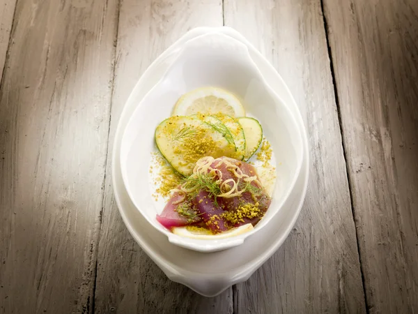 Tuna carpaccio with slice cucumber and grind pistachio — Stock Photo, Image