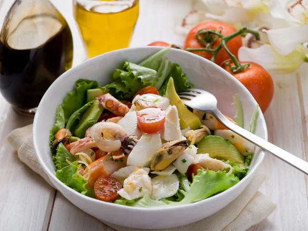 Mixed seafood salad with mozzarella and avocado — Stock Photo, Image
