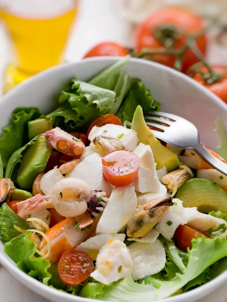 Mixed seafood salad with mozzarella and avocado — Stock Photo, Image