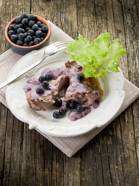 Lamb rib with blueberries sauce — Stock Photo, Image