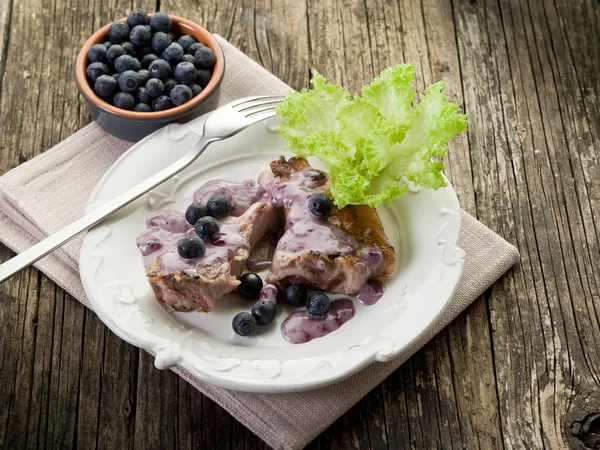 Lamb rib with blueberries sauce — Stock Photo, Image