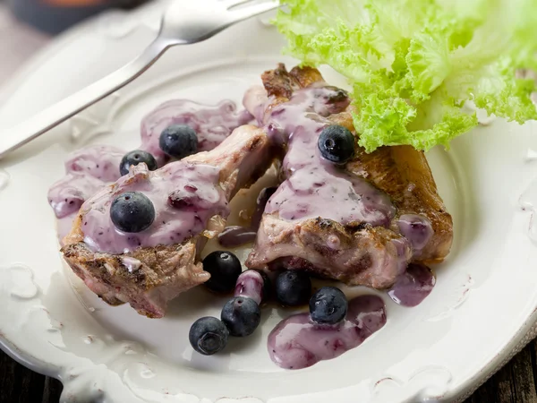 stock image Lamb rib with blueberries sauce