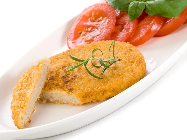 Slice vegetarian cutlet with slice tomatoes — Stock Photo, Image