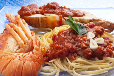 Spaghetti with lobster and tomato sauce clipart