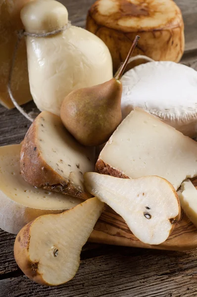 Variety of italian cheese and pears — Stock Photo, Image
