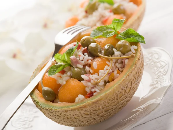 stock image Rice salad over open melon