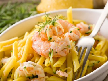 Pasta with shrimp and zucchinis clipart