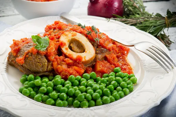 stock image Marrow bone with green peas