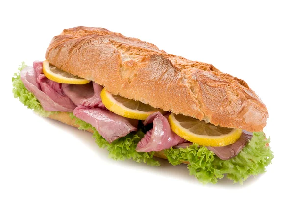 Sandwich with roastbeef lettuce and slice lemon — Stock Photo, Image