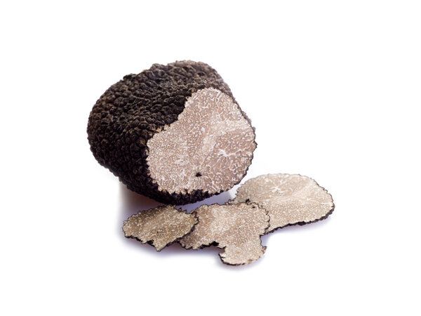 Slice black truffle on white background