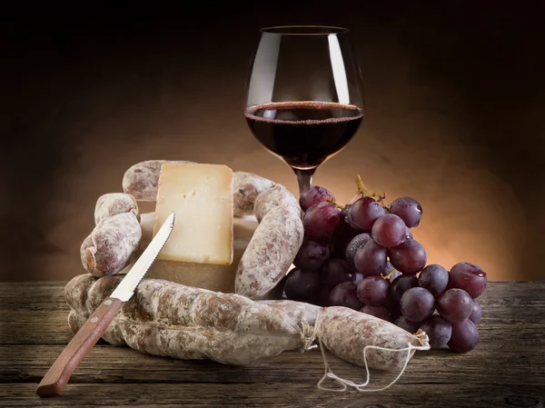 Cheese salami grapes and red wine — Stock Photo, Image