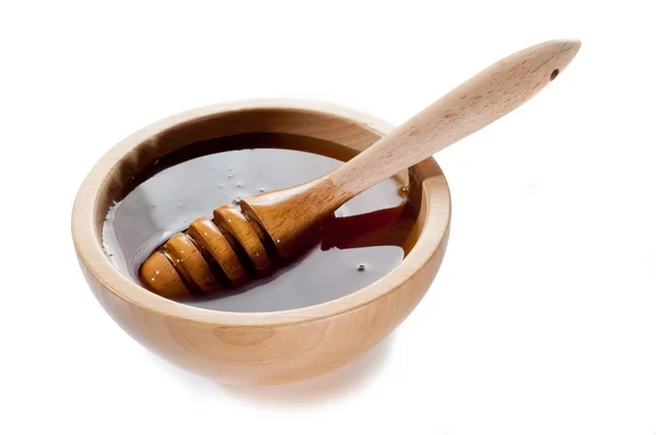 Honung på trä skål — Stockfoto