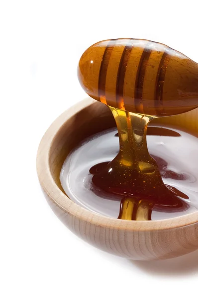Miel en cuenco de madera —  Fotos de Stock