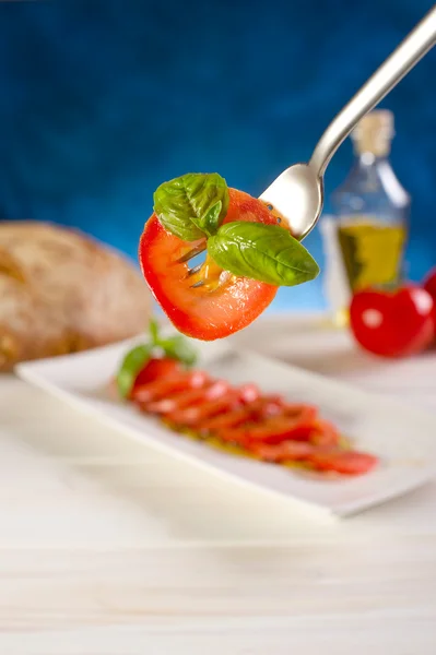 Sliced tomatoes on dish — Stock Photo, Image
