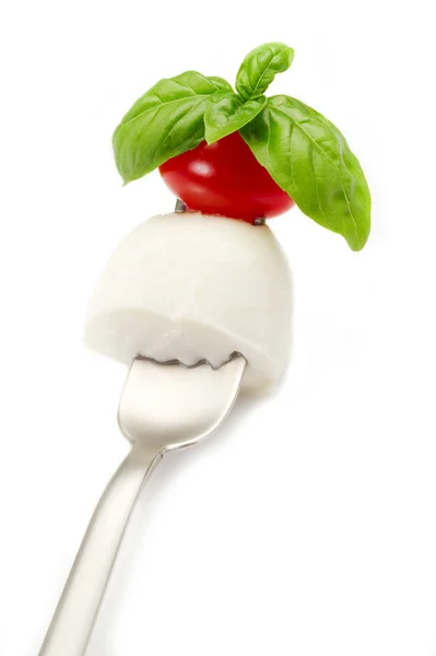 Fork with mozzarella tomato and basil — Stock Photo, Image