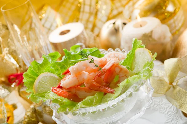 Shrimp cocktail on golden table — Stock Photo, Image