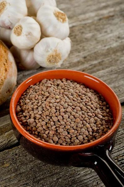 Raw lentil on bowl — Stock Photo, Image