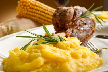 Shank with polenta clipart