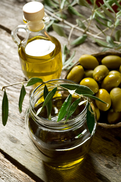 Olive oil on wood background