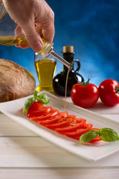 Tomates fatiados no prato — Fotografia de Stock